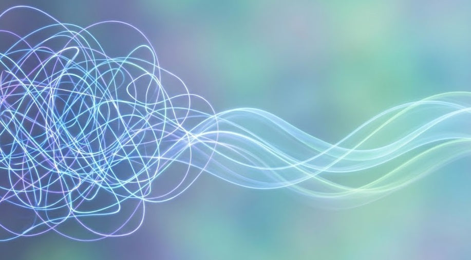 A conceptual image showing a tangled mass of glowing blue and purple lines on the left, representing anxious thoughts, which gradually smooth out into clear, calm, flowing waves on the right, symbolizing the relief and clarity from EMDR therapy.